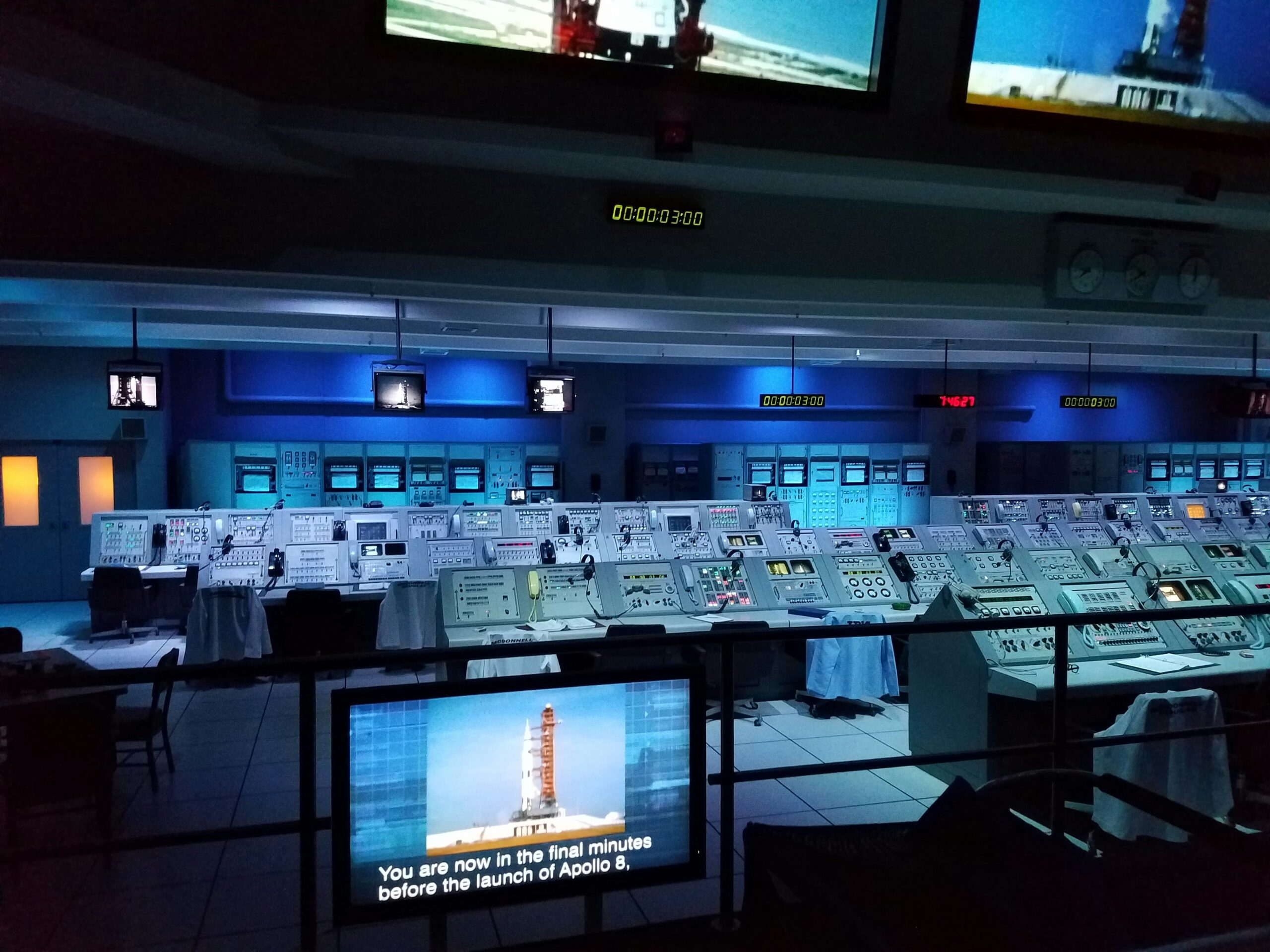 Air traffic controllers monitoring radar screens inside an FAA en route control center