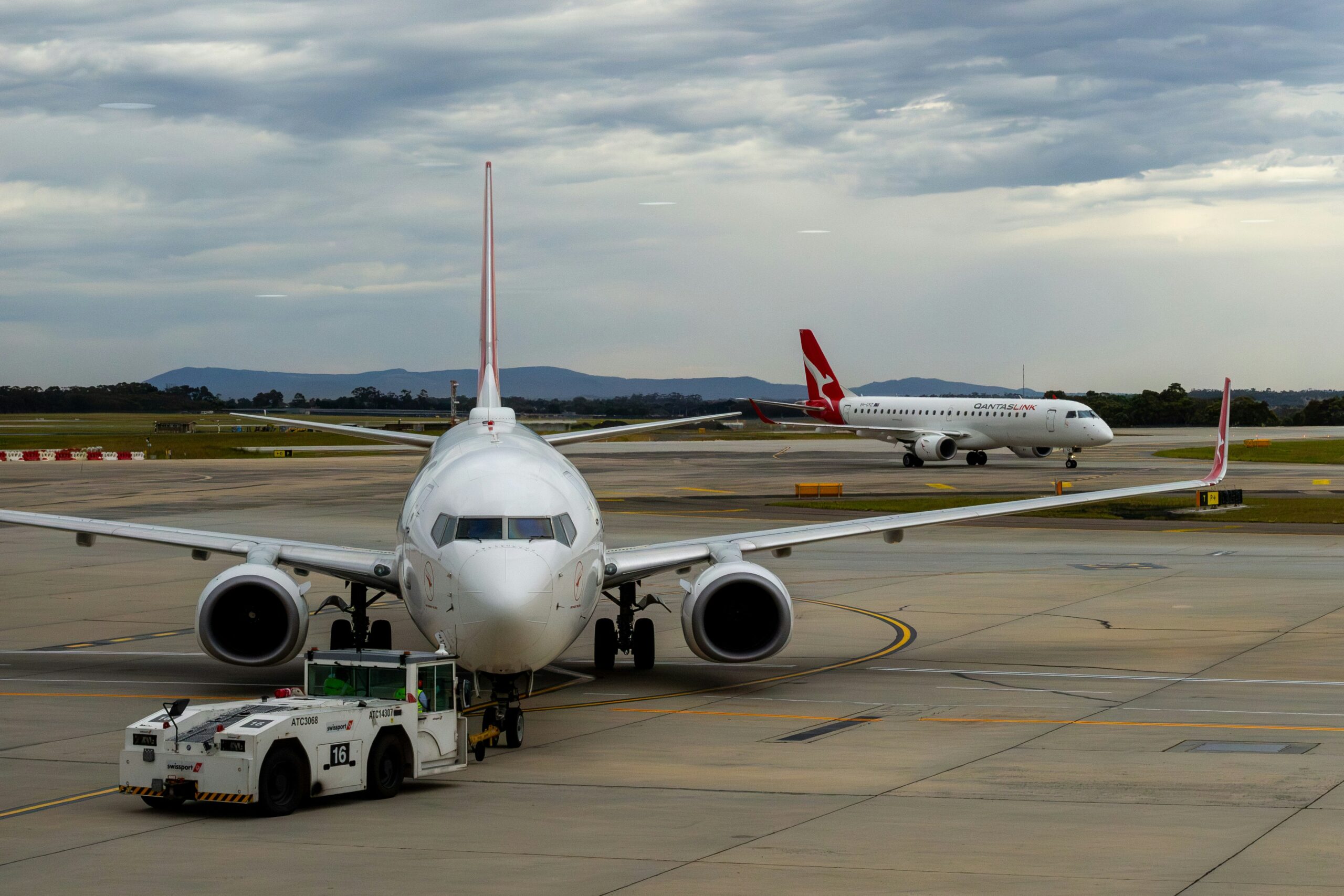 Multiple aircraft parked on tarmac representing the Pratt and Whitney GTF engine grounding crisis that hit Spirit Airlines
