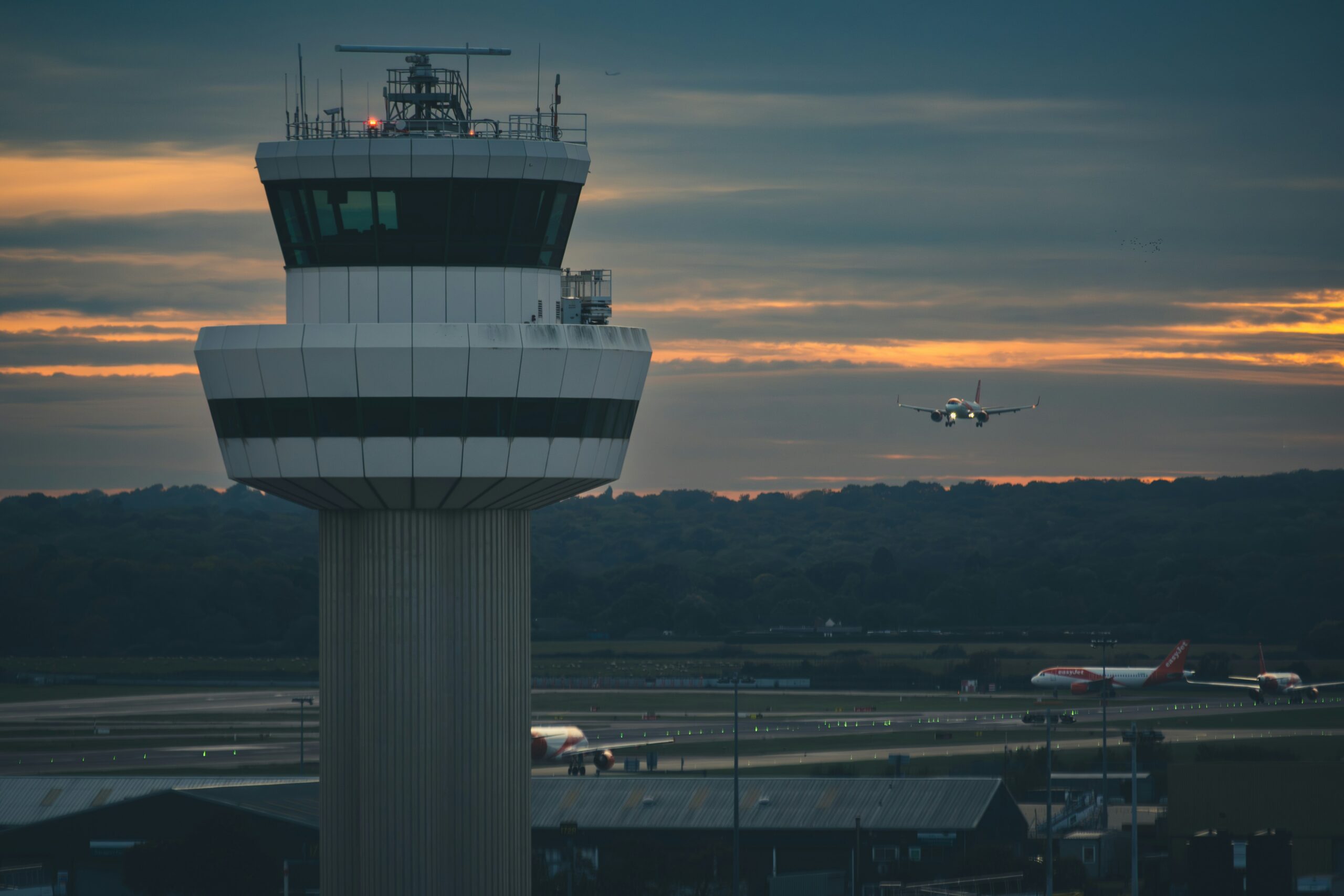 Airport control tower at dusk — FAA air traffic control staffing and safety