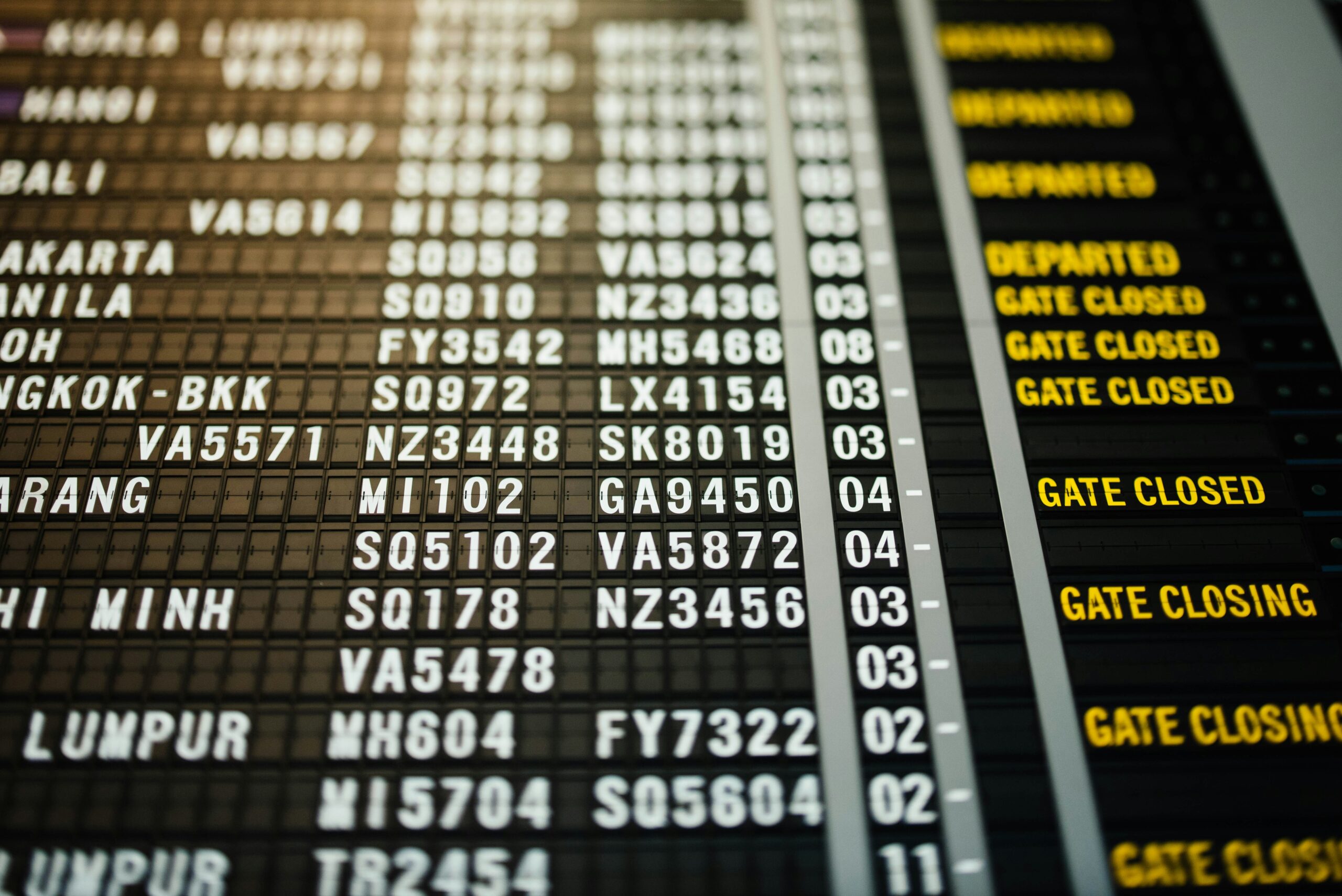 Airport departure board displaying flight schedule information
