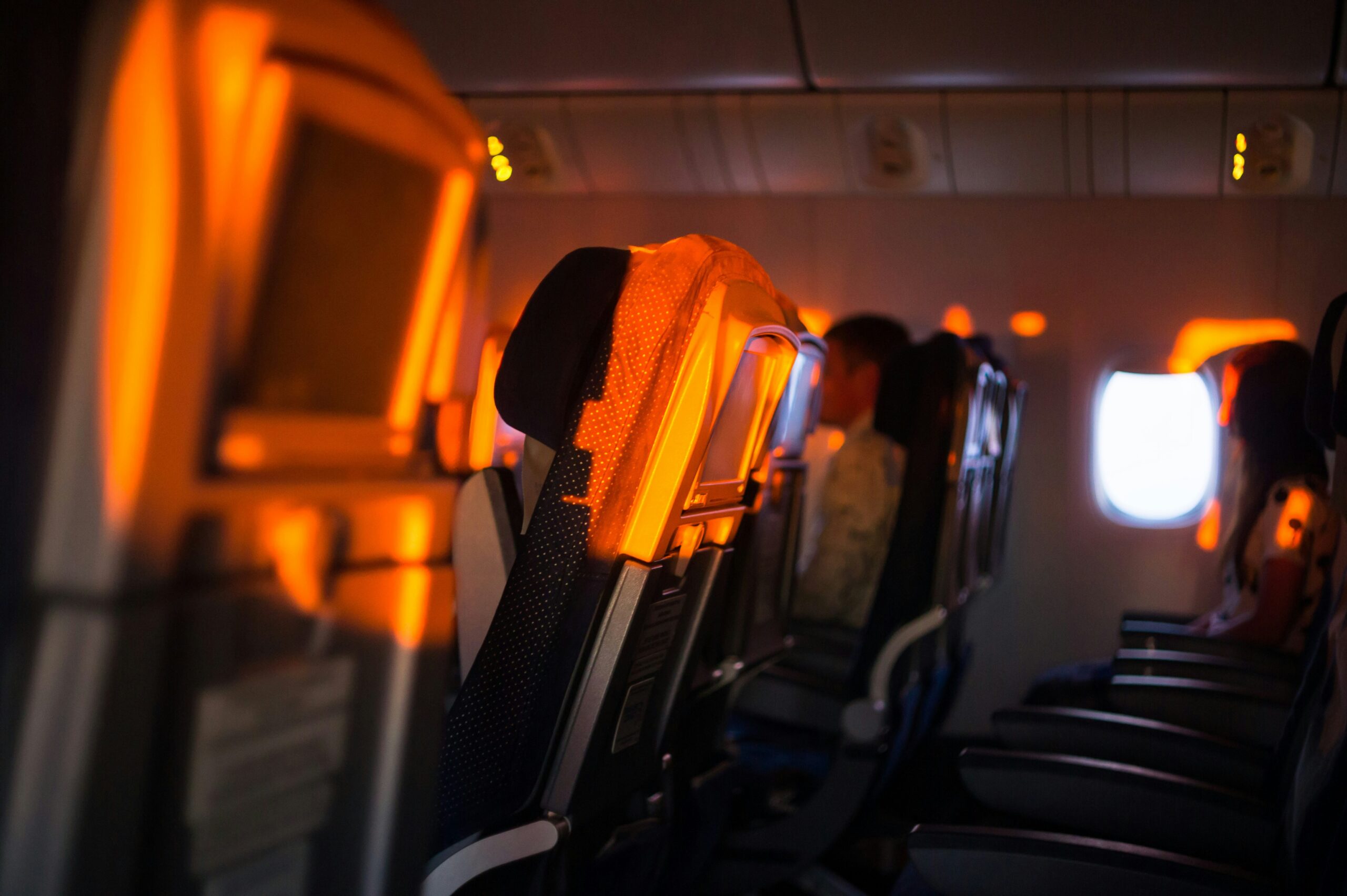 Empty economy cabin seats representing rising airfare prices following Spirit Airlines collapse in 2026